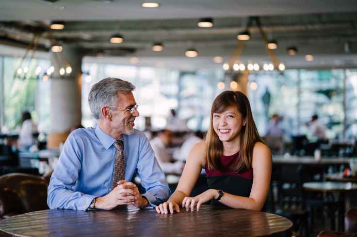 photography of man and woman sitting together